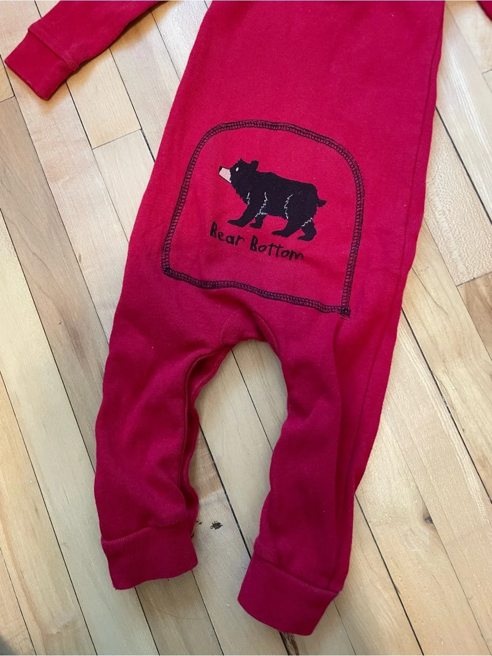 Lazy One Bear Bottoms red cotton baby onesie with black bear graphic Flap Jack